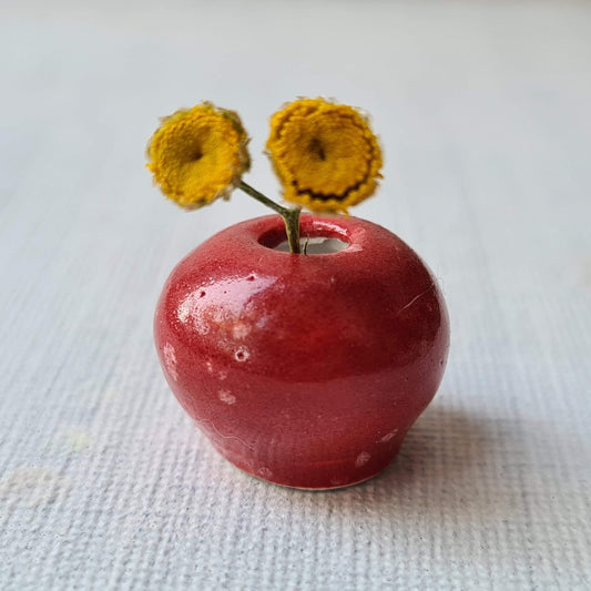 Minivaasje van porselein, rood, met geel bloemetje